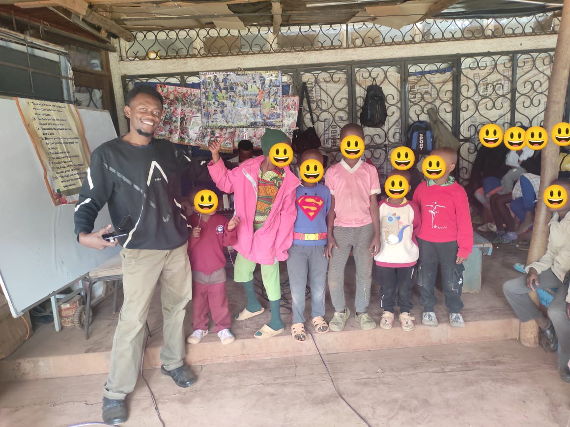 teacher James singing with children