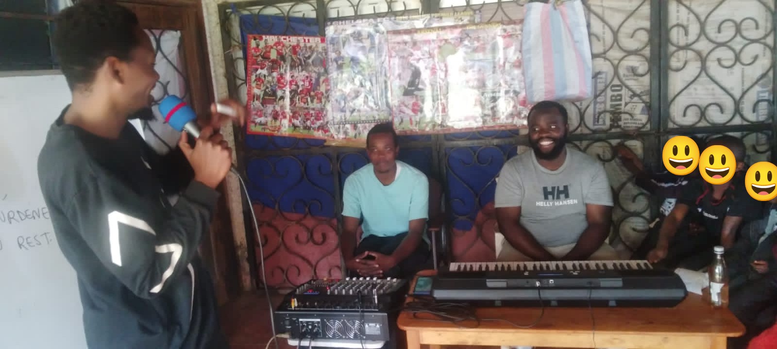 teacher Cyrus playing piano for children