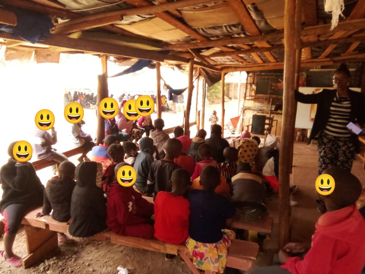 teacher Stella teaching children